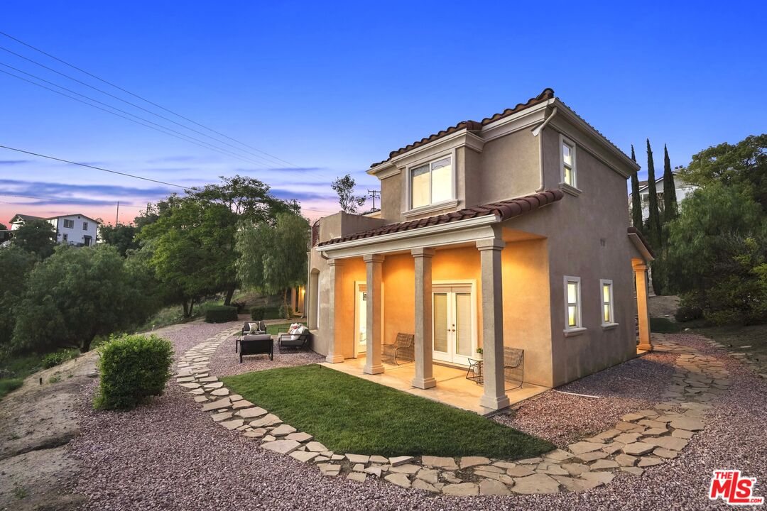 969 Crown Hill Drive Simi Valley, CA 93063 - Photo 51 of 62 a view of a house with a yard