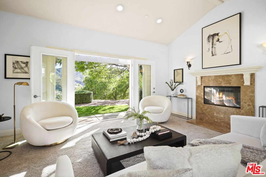 969 Crown Hill Drive Simi Valley, CA 93063 - Photo 10 of 62 a living room with furniture and a fireplace