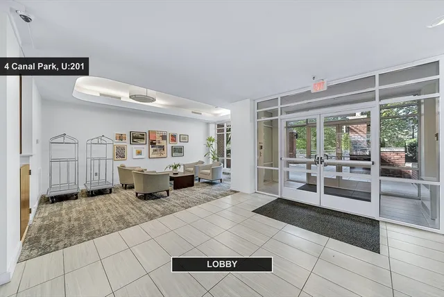 a living room with fireplace furniture and a table