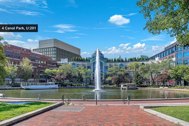 a view of building with garden and swimming pool