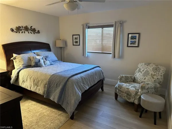 a bedroom with a bed and couch