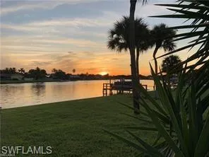 a view of a lake with a big yard