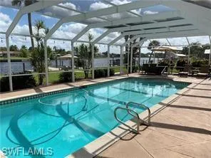 a view of a swimming pool with a patio