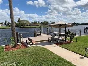 a view of a backyard with sitting area and slide
