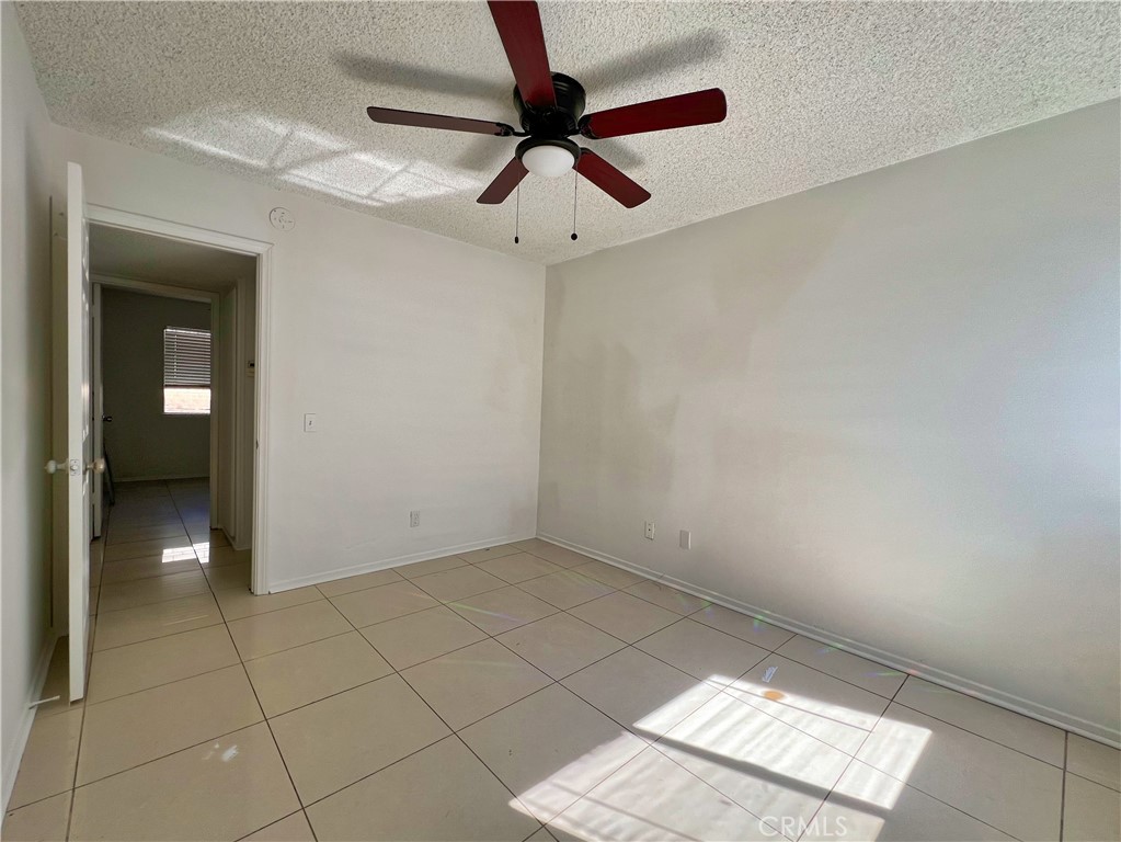 22574 Kentfield Street Grand Terrace, CA 92313 - Photo 11 of 22 a view of an empty room and window
