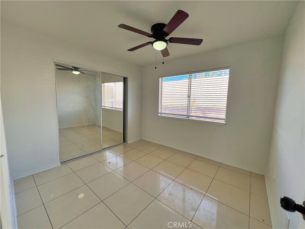 22574 Kentfield Street Grand Terrace, CA 92313 - Photo 13 of 22 a view of an empty room with a window