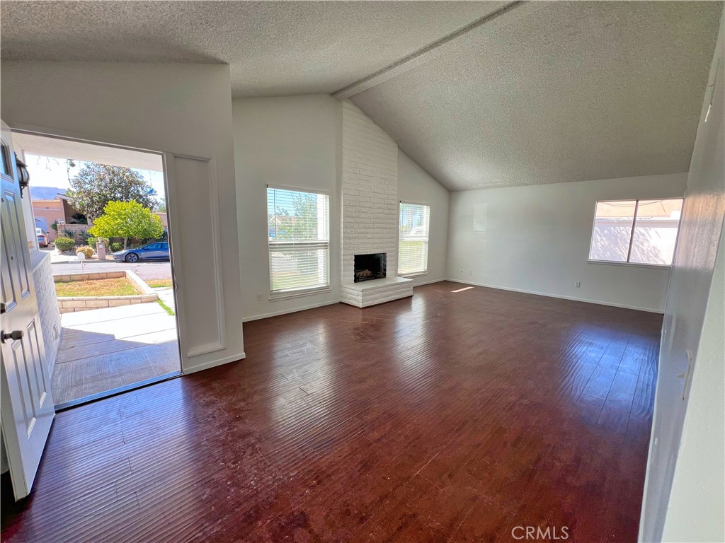 22574 Kentfield Street Grand Terrace, CA 92313 - Photo 2 of 22 an empty room with wooden floor and windows