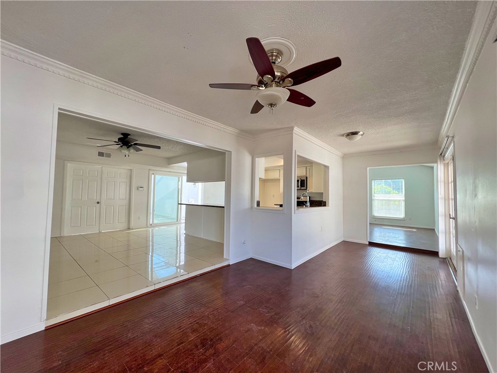 22574 Kentfield Street Grand Terrace, CA 92313 - Photo 7 of 22 wooden floor in an empty room with a window