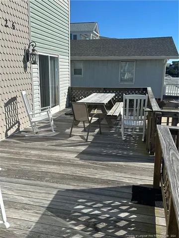 a roof deck view with a seating space