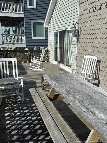 a view of a patio with wooden floor
