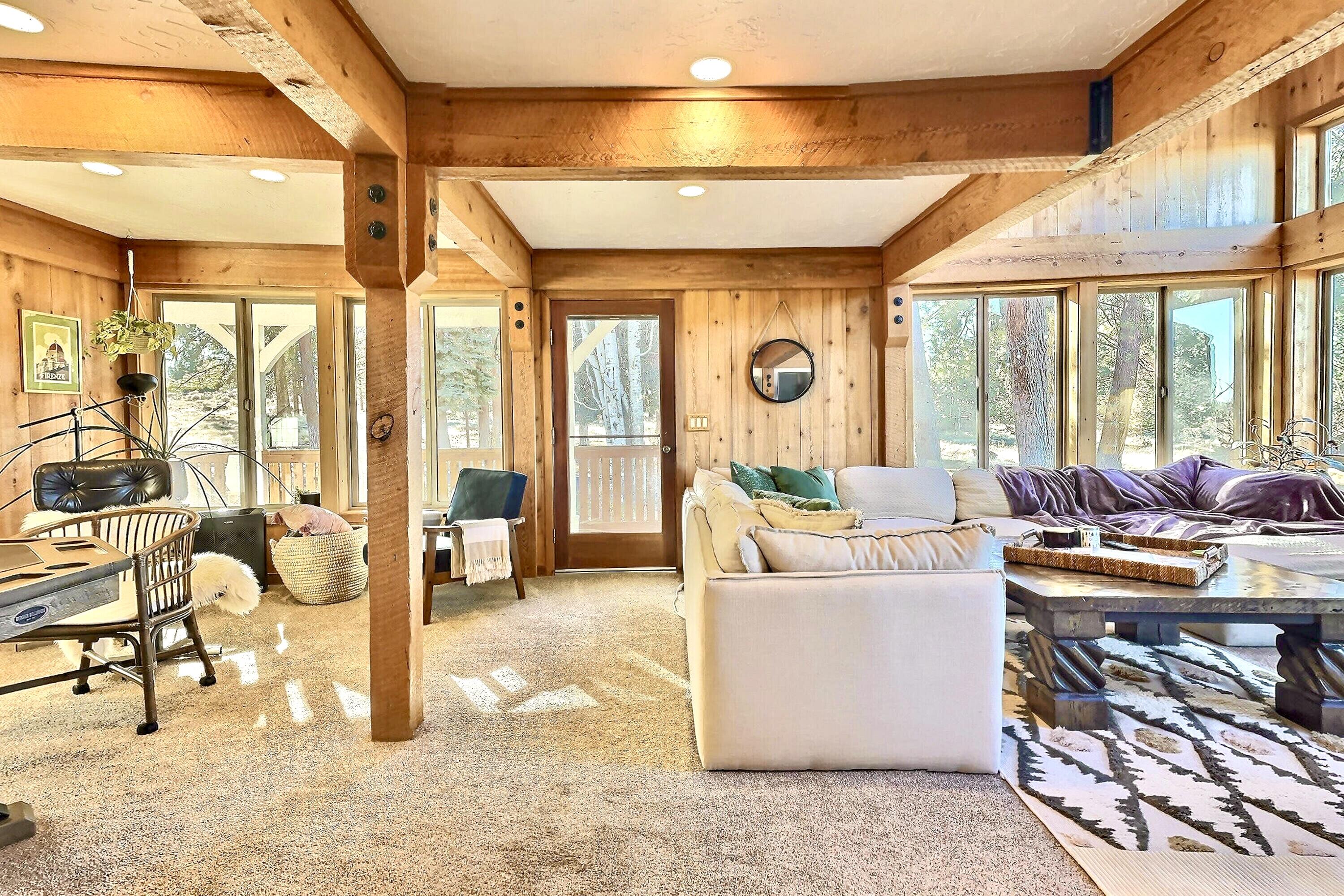 60359 Arnold Market Road Bend, OR 97702 - Photo 9 of 64 Huge windows and natural light throughout the home. Cedar accented walls and exposed old-growth posts and beams throughout
