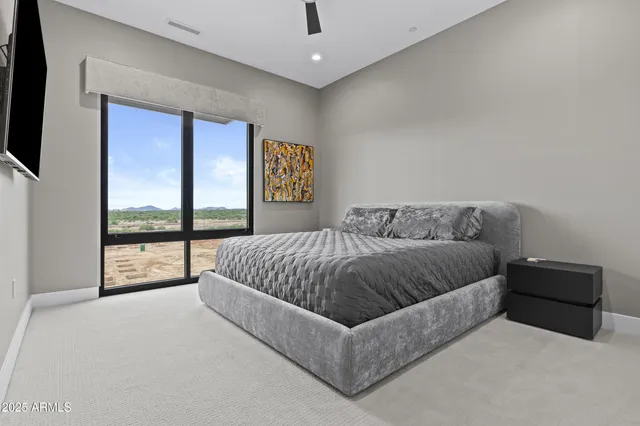 a living room with a couch and next to a window