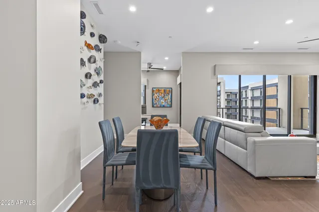 a dining room with furniture and window