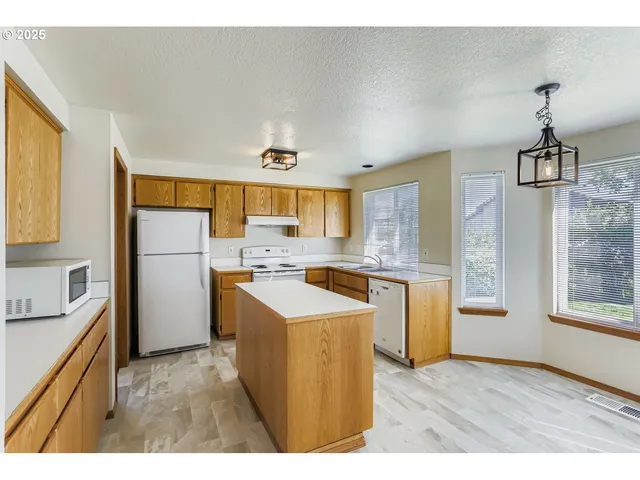 a kitchen that has a cabinets and a stove