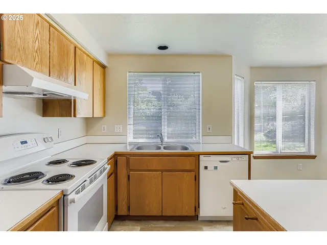 a view of an empty room with a fireplace