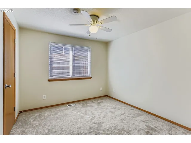 a bathroom with a sink a toilet a mirror and shower