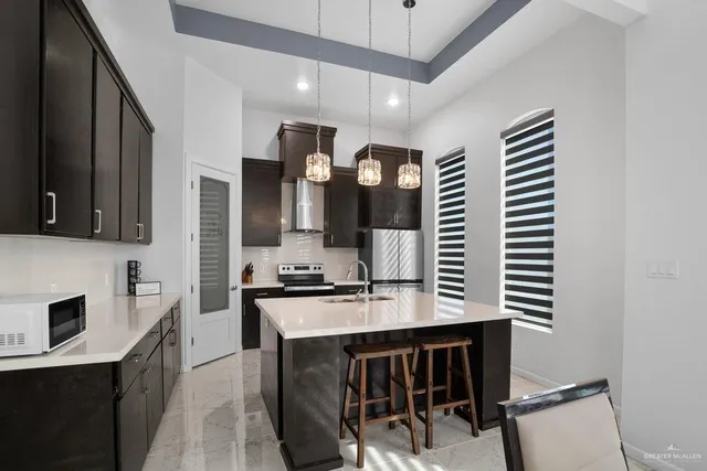a kitchen with a sink cabinets and window