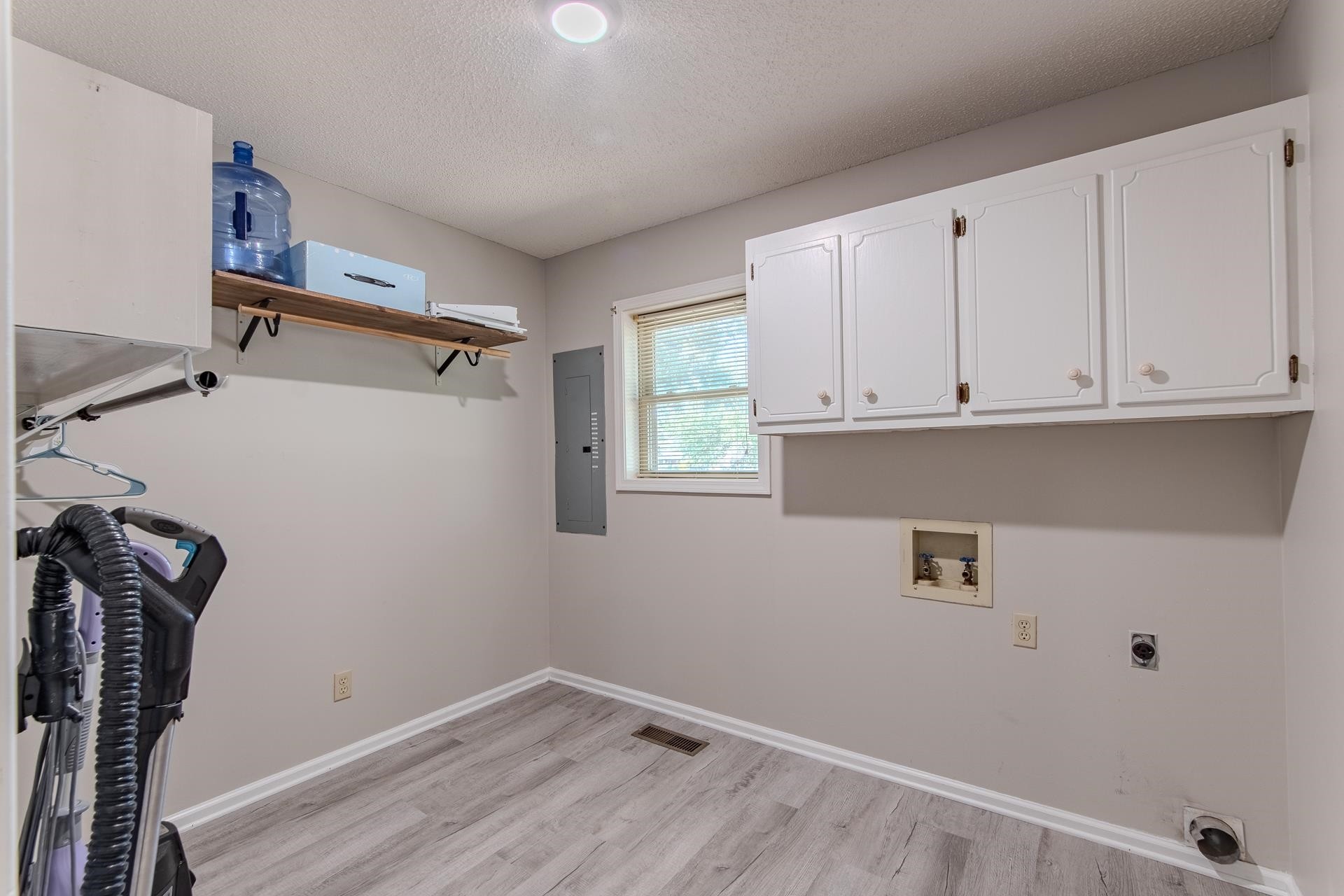 606 Duren Drive Adamsville, TN 38310 - Photo 17 of 40 a view of a storage & utility room with a window
