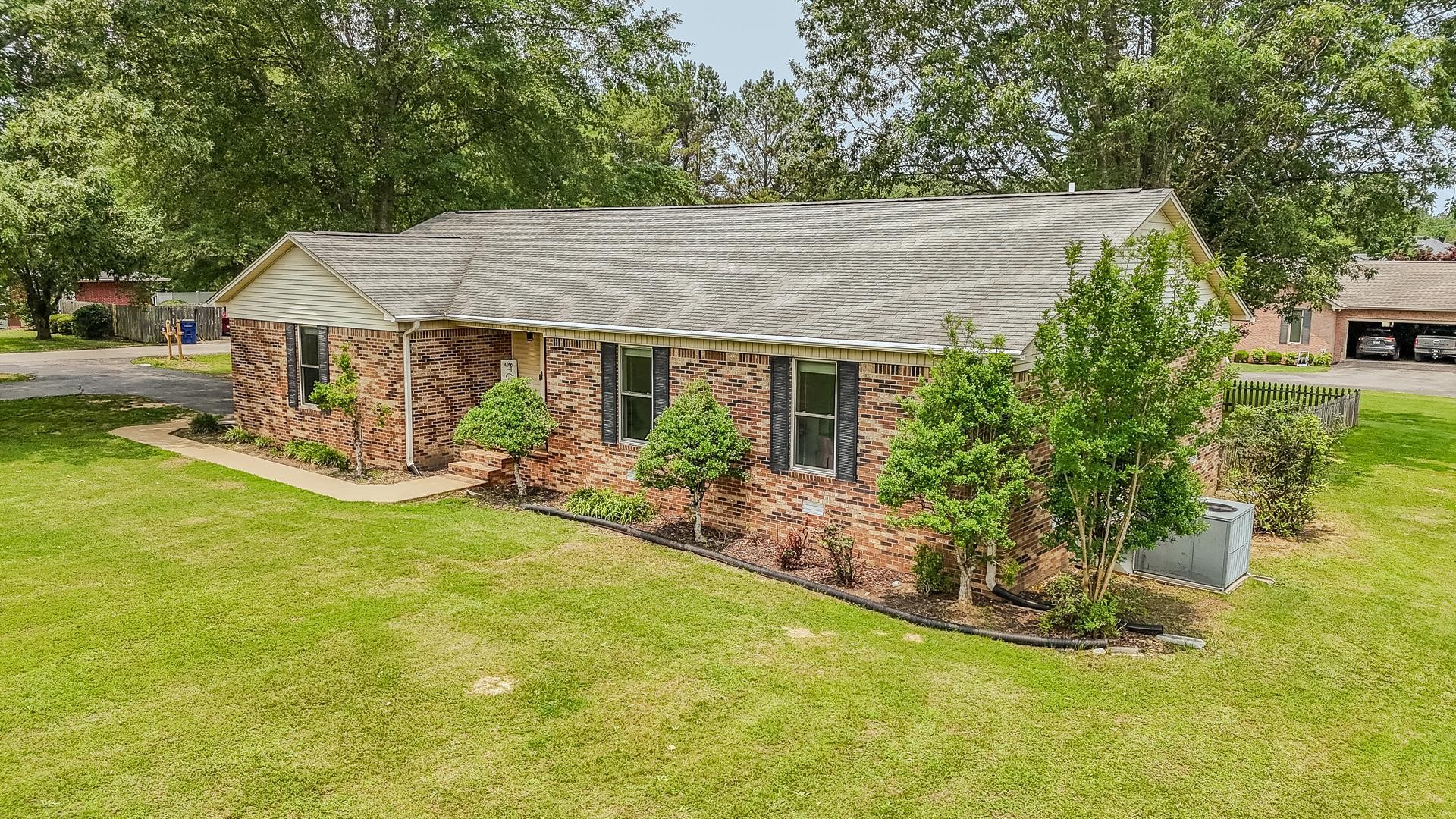606 Duren Drive Adamsville, TN 38310 - Photo 2 of 40 a view of a house with a yard patio and fire pit