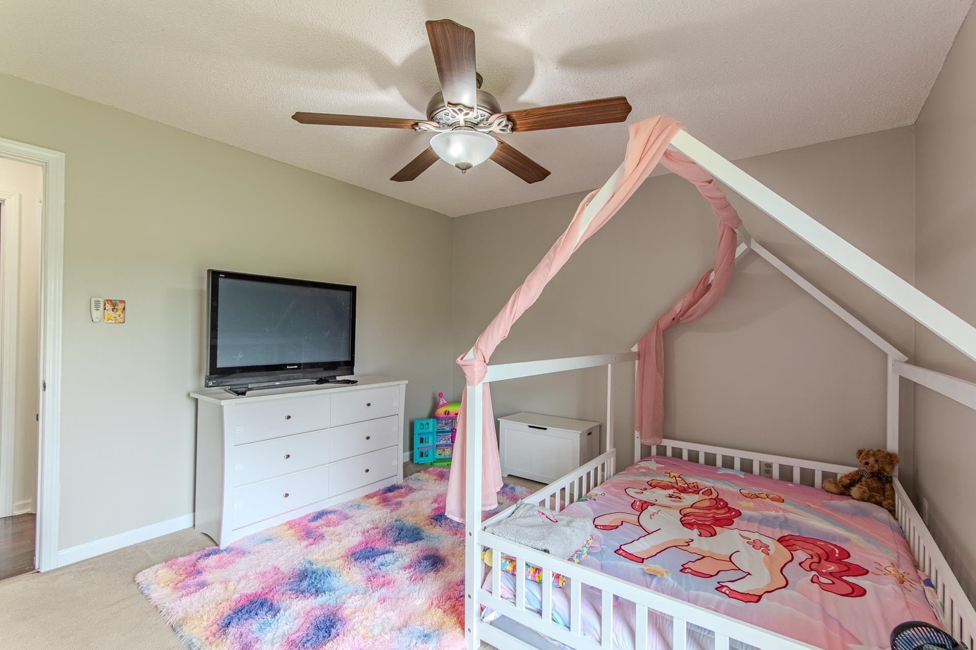 606 Duren Drive Adamsville, TN 38310 - Photo 22 of 40 a bedroom with a bed and flat screen tv