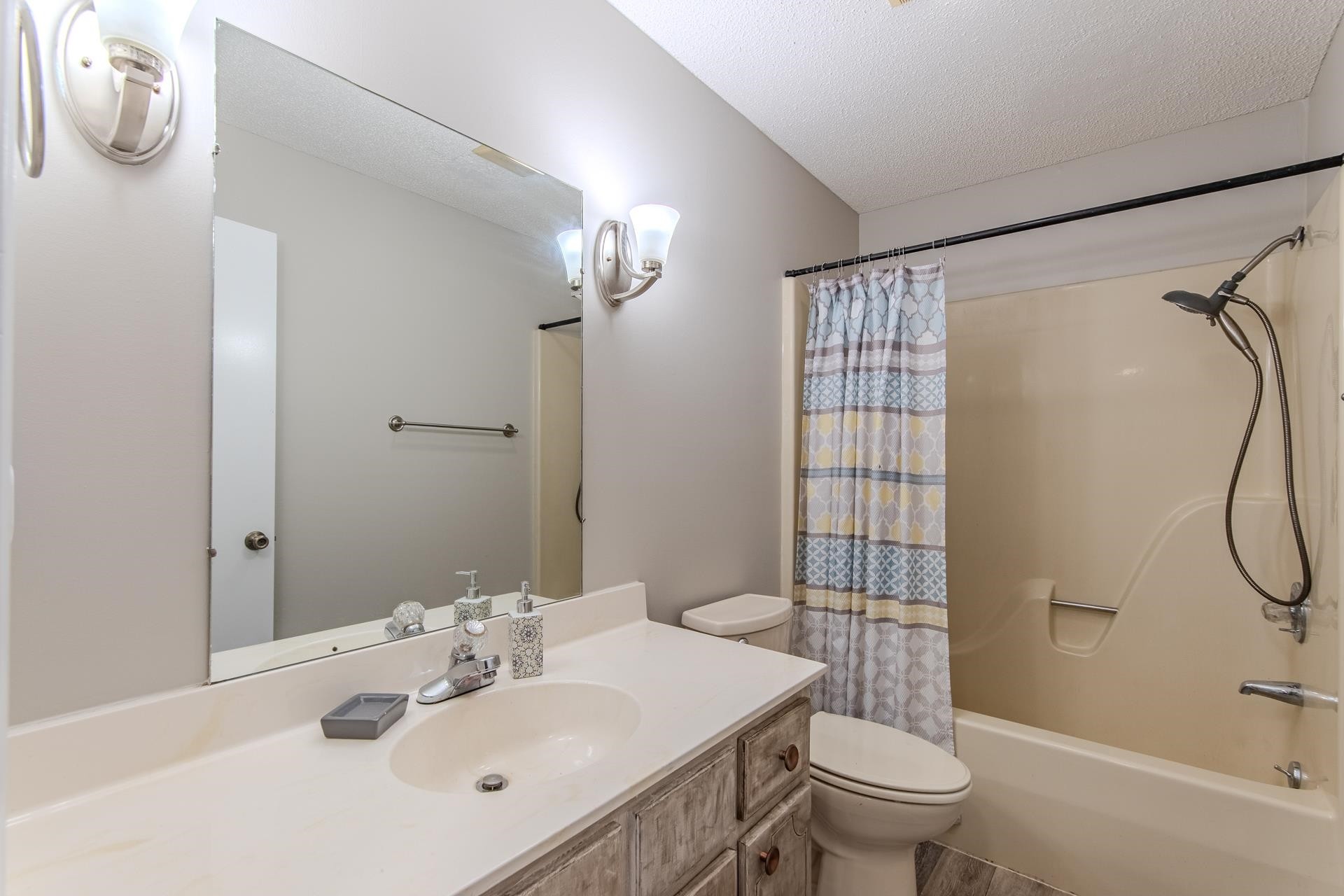 606 Duren Drive Adamsville, TN 38310 - Photo 23 of 40 a bathroom with a sink toilet tub and shower