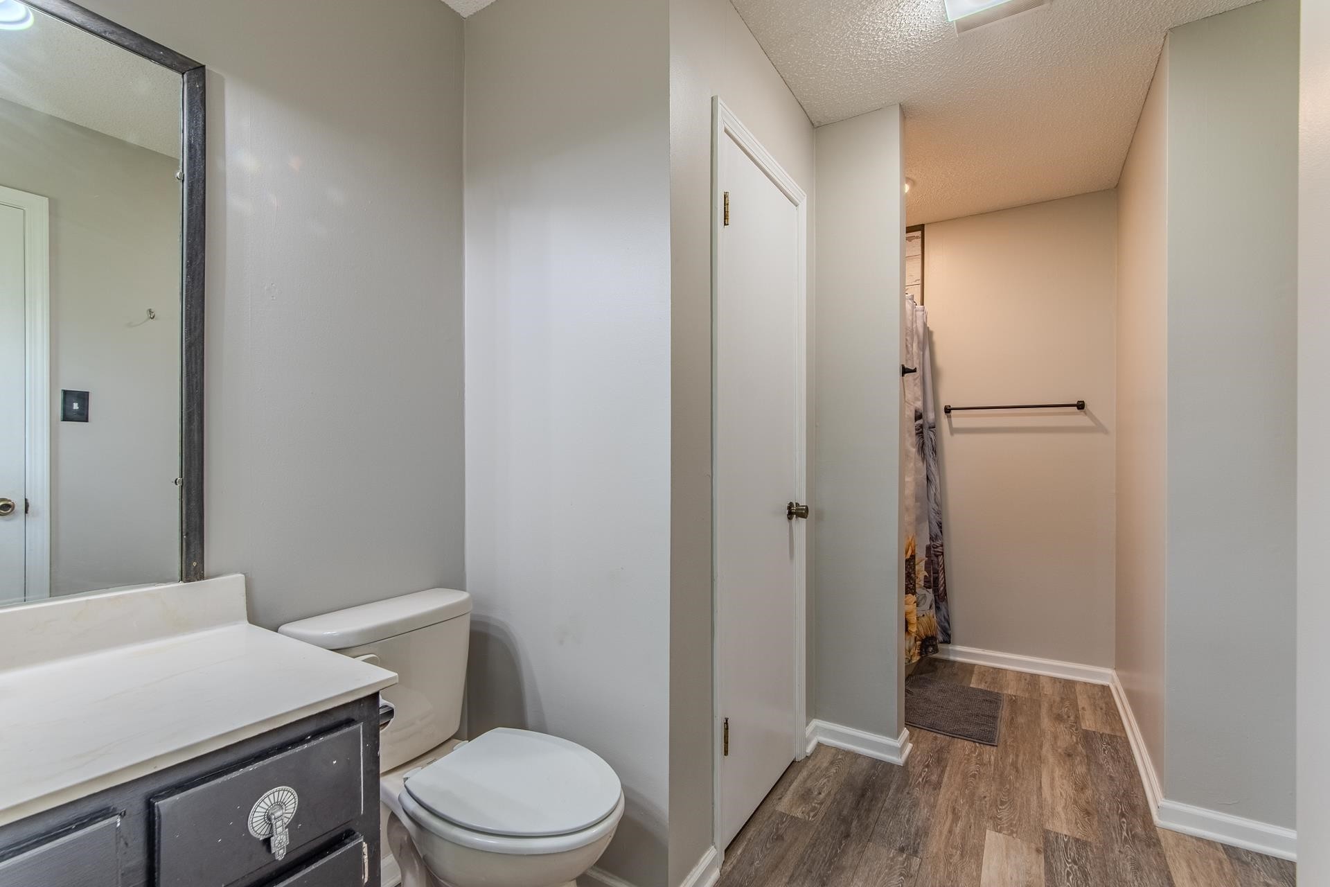 606 Duren Drive Adamsville, TN 38310 - Photo 29 of 40 a bathroom with a granite countertop toilet and a sink