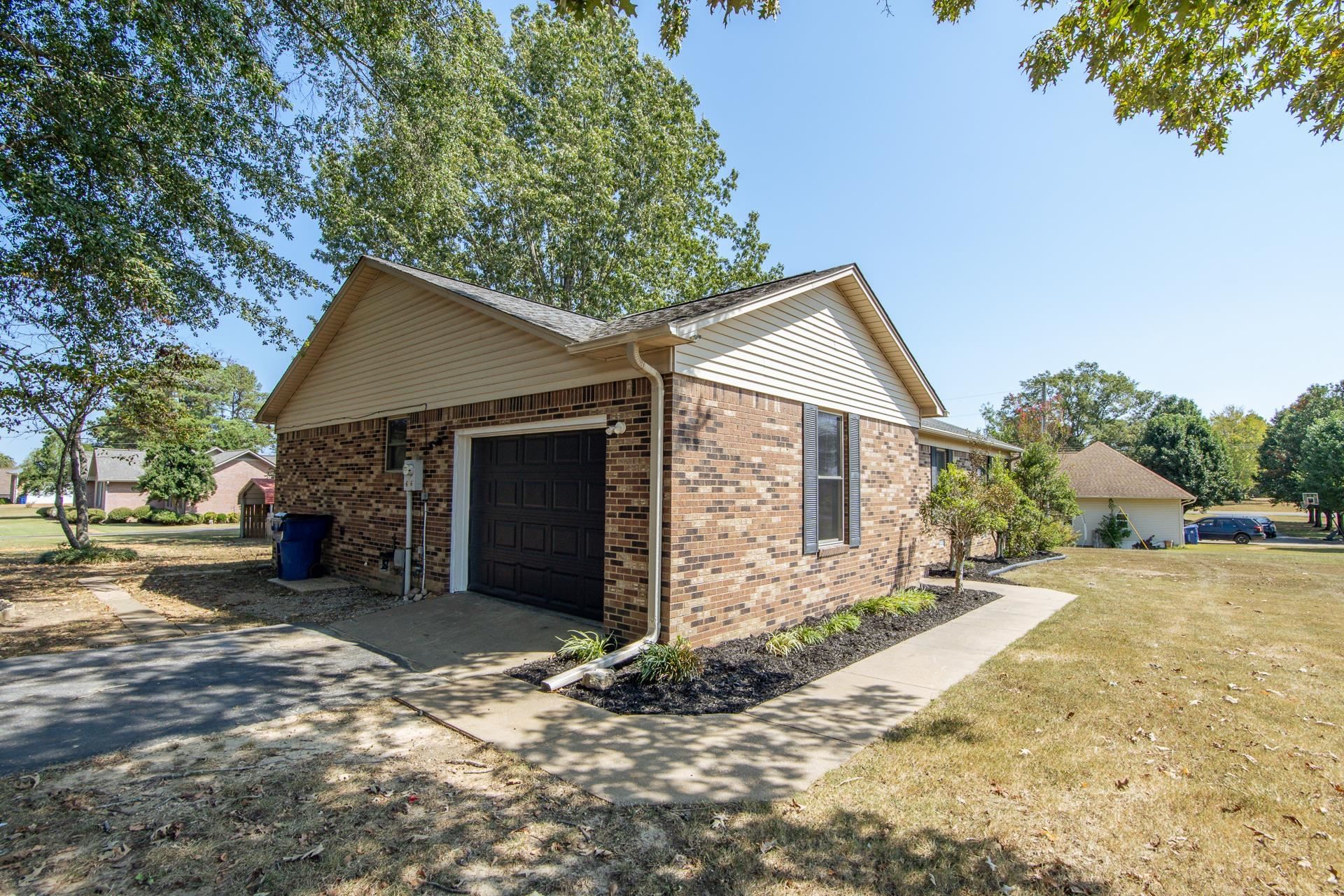 606 Duren Drive Adamsville, TN 38310 - Photo 3 of 40 a view of a house with a yard and garage