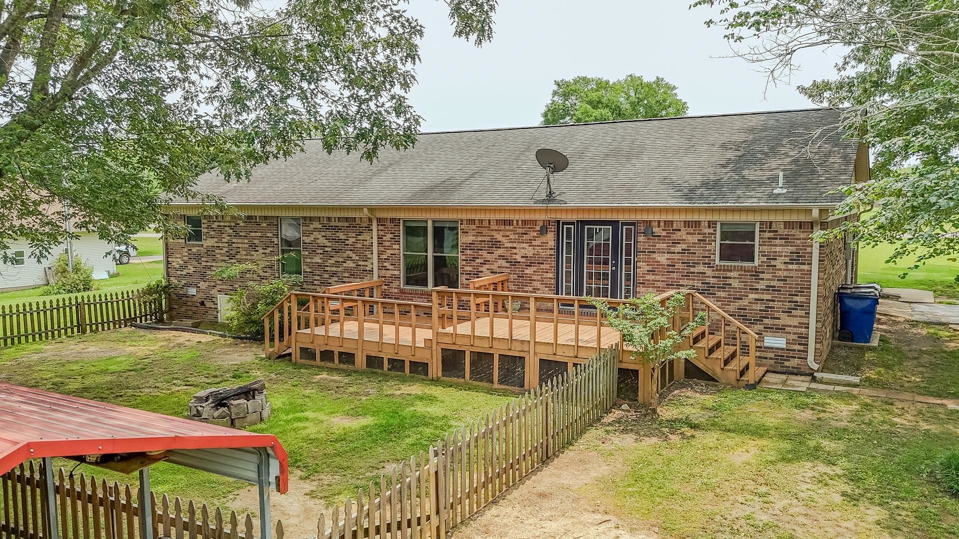 606 Duren Drive Adamsville, TN 38310 - Photo 36 of 40 aerial view of a house with backyard and porch