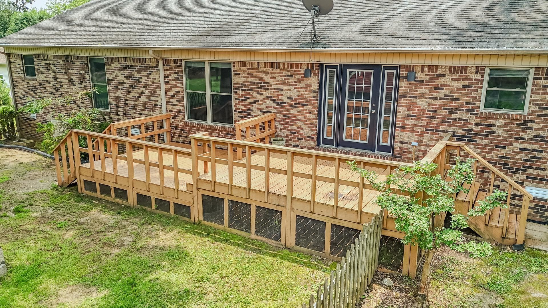 606 Duren Drive Adamsville, TN 38310 - Photo 37 of 40 front view of a house with a large window