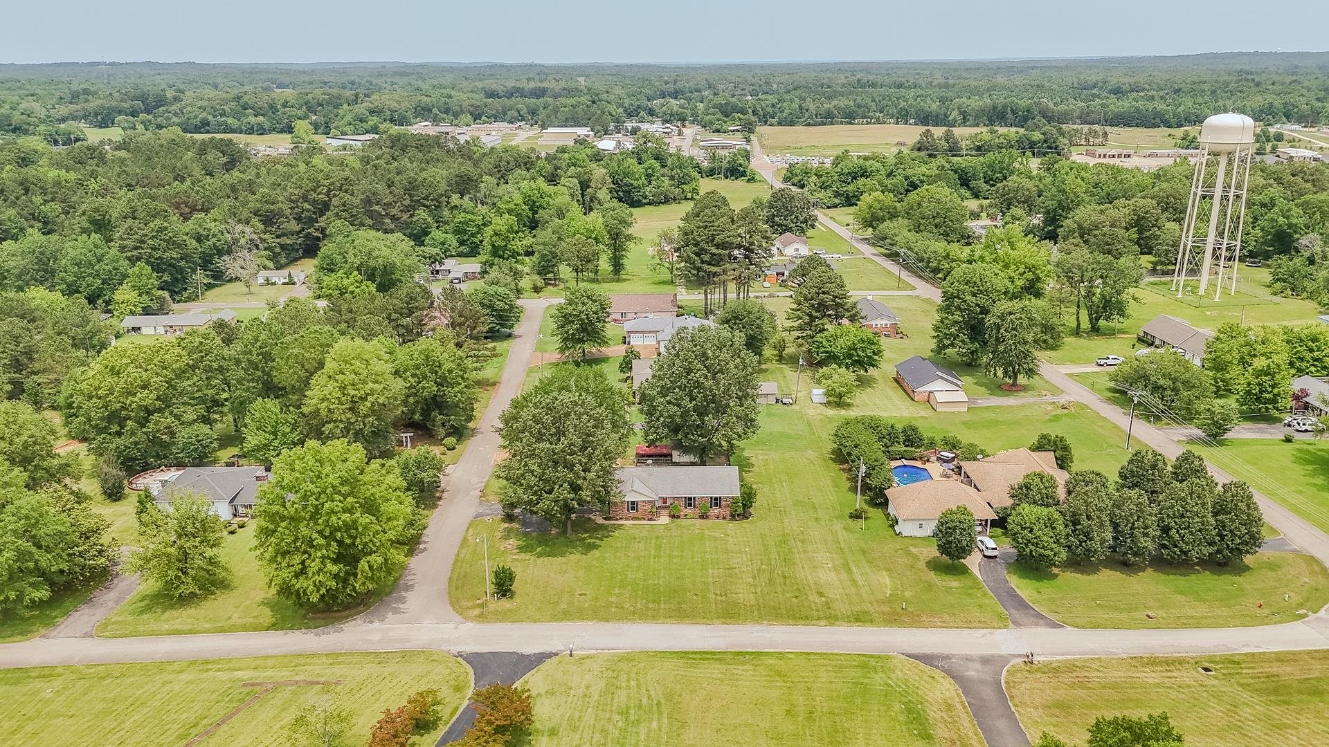 606 Duren Drive Adamsville, TN 38310 - Photo 5 of 40 an aerial view of residential houses with outdoor space