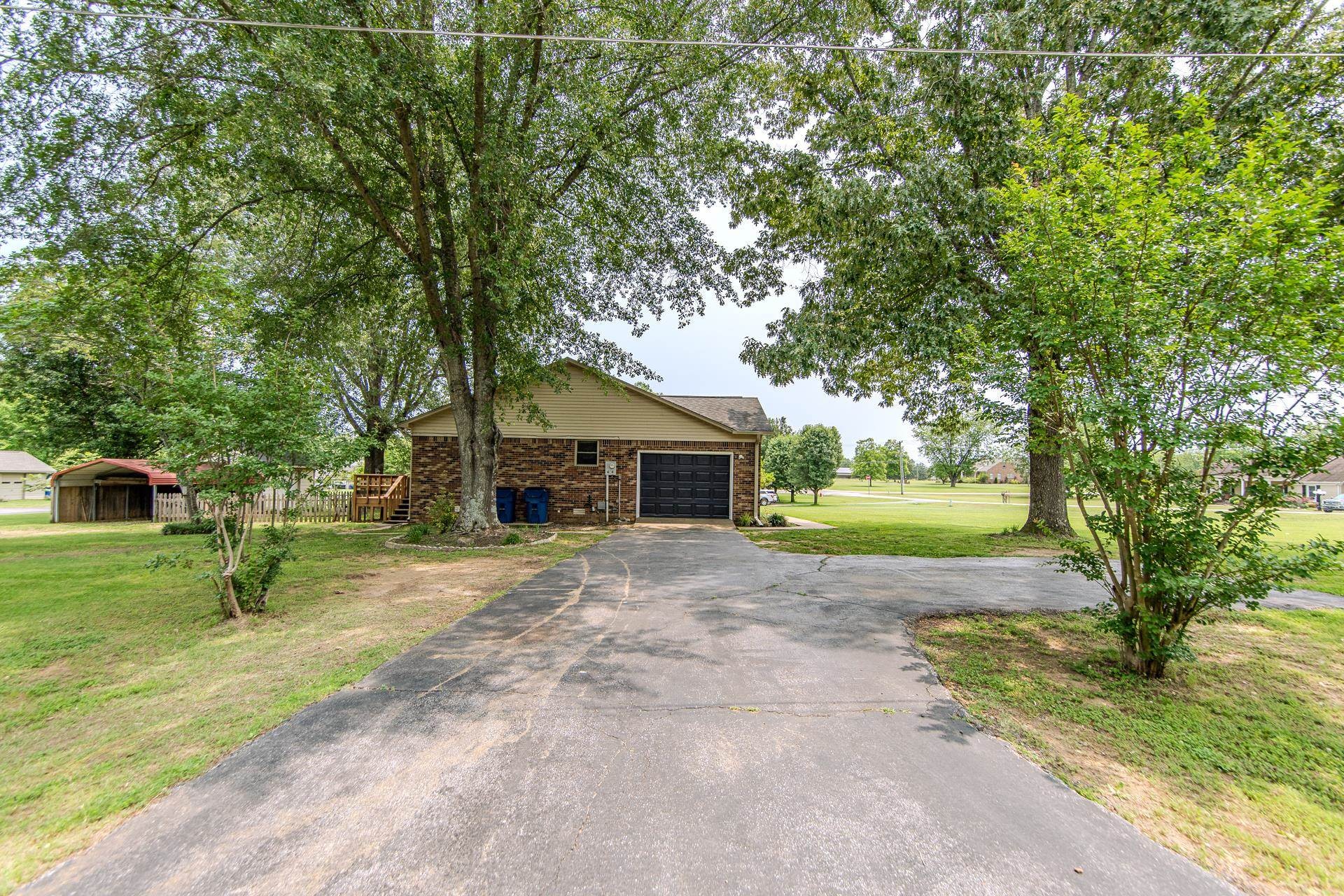 606 Duren Drive Adamsville, TN 38310 - Photo 7 of 40 a house view with a garden space