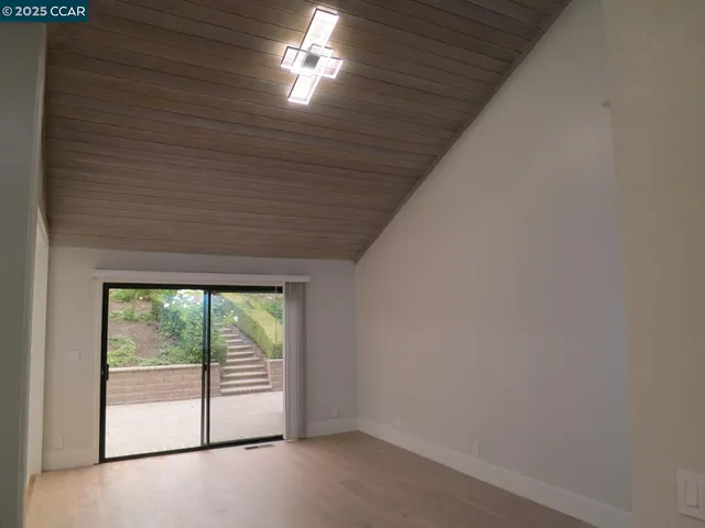 a view of an empty room with a window