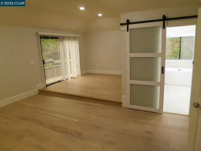 a view of an empty room with a cabinet