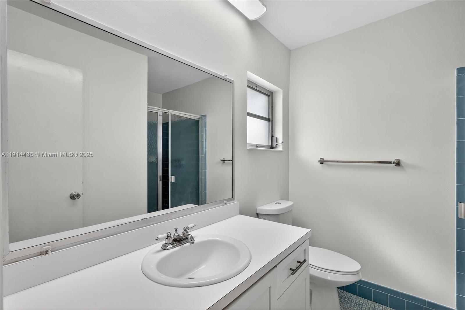 5331 Belleville Road West Palm Beach, FL 33417 - Photo 18 of 49 a bathroom with a sink toilet and a mirror