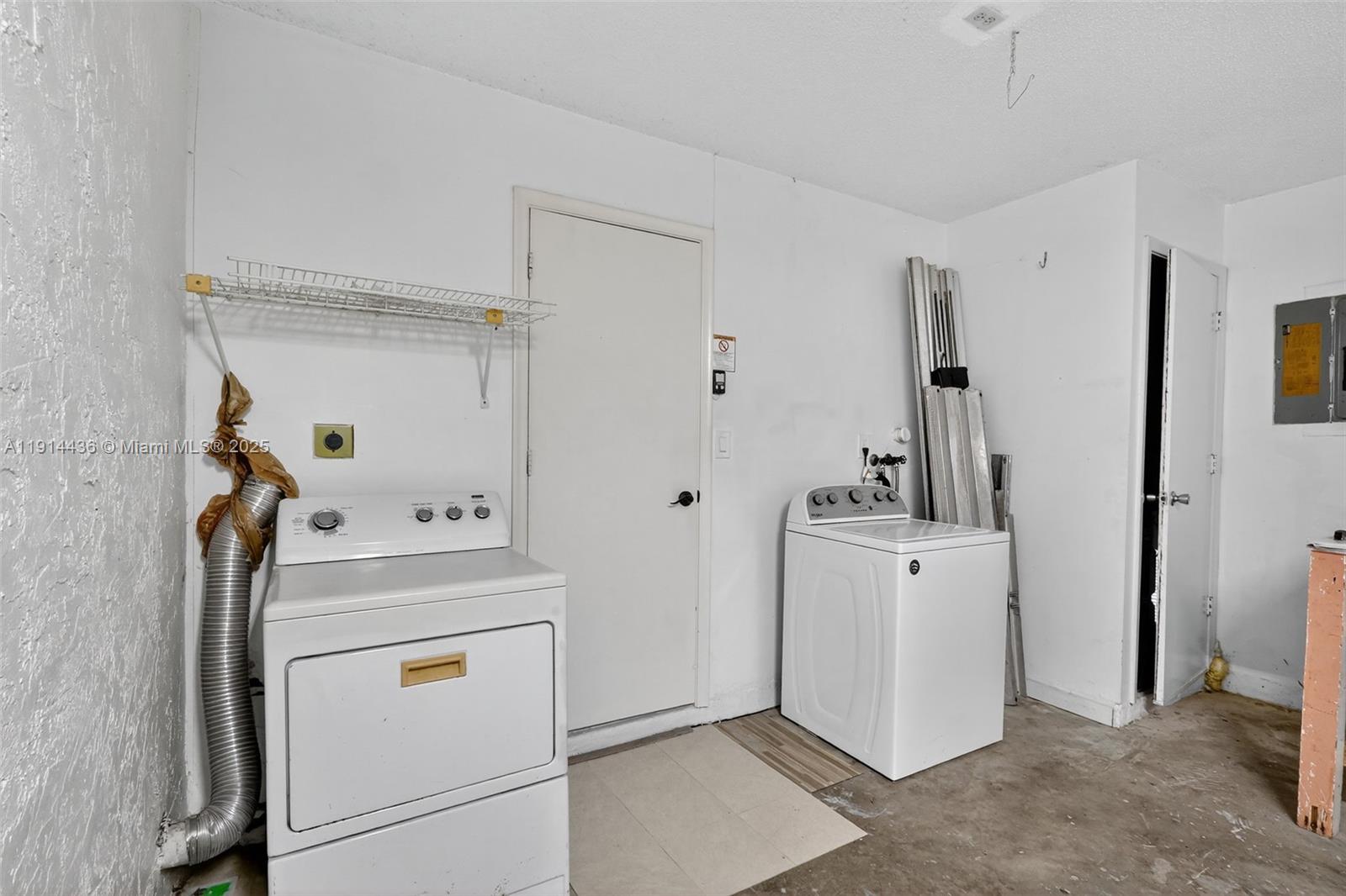 5331 Belleville Road West Palm Beach, FL 33417 - Photo 32 of 49 a utility room with dryer and washer