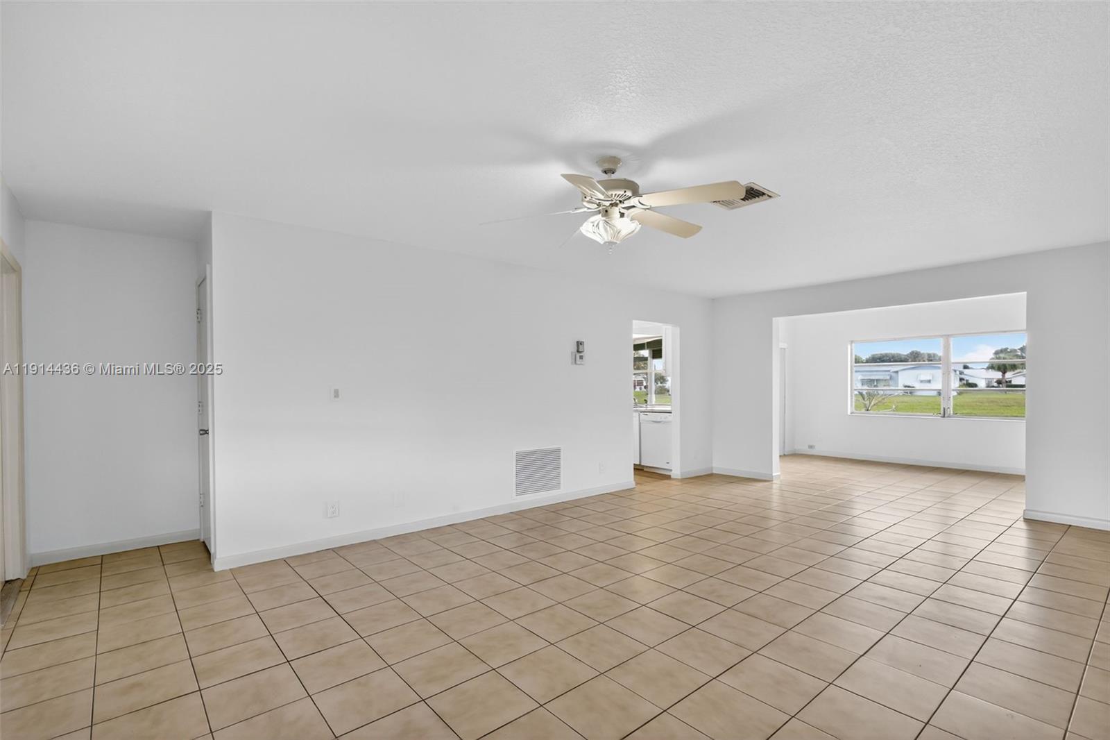5331 Belleville Road West Palm Beach, FL 33417 - Photo 8 of 49 an empty room with windows and ceiling fan