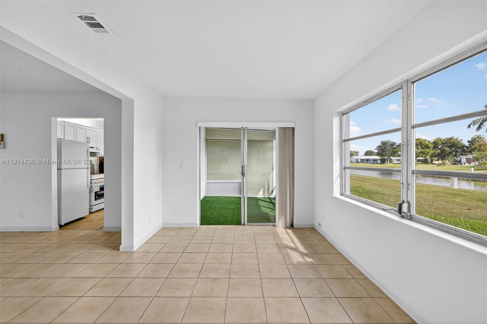 5331 Belleville Road West Palm Beach, FL 33417 - Photo 10 of 49 a view of an entryway of a room with a floor to ceiling window and a room