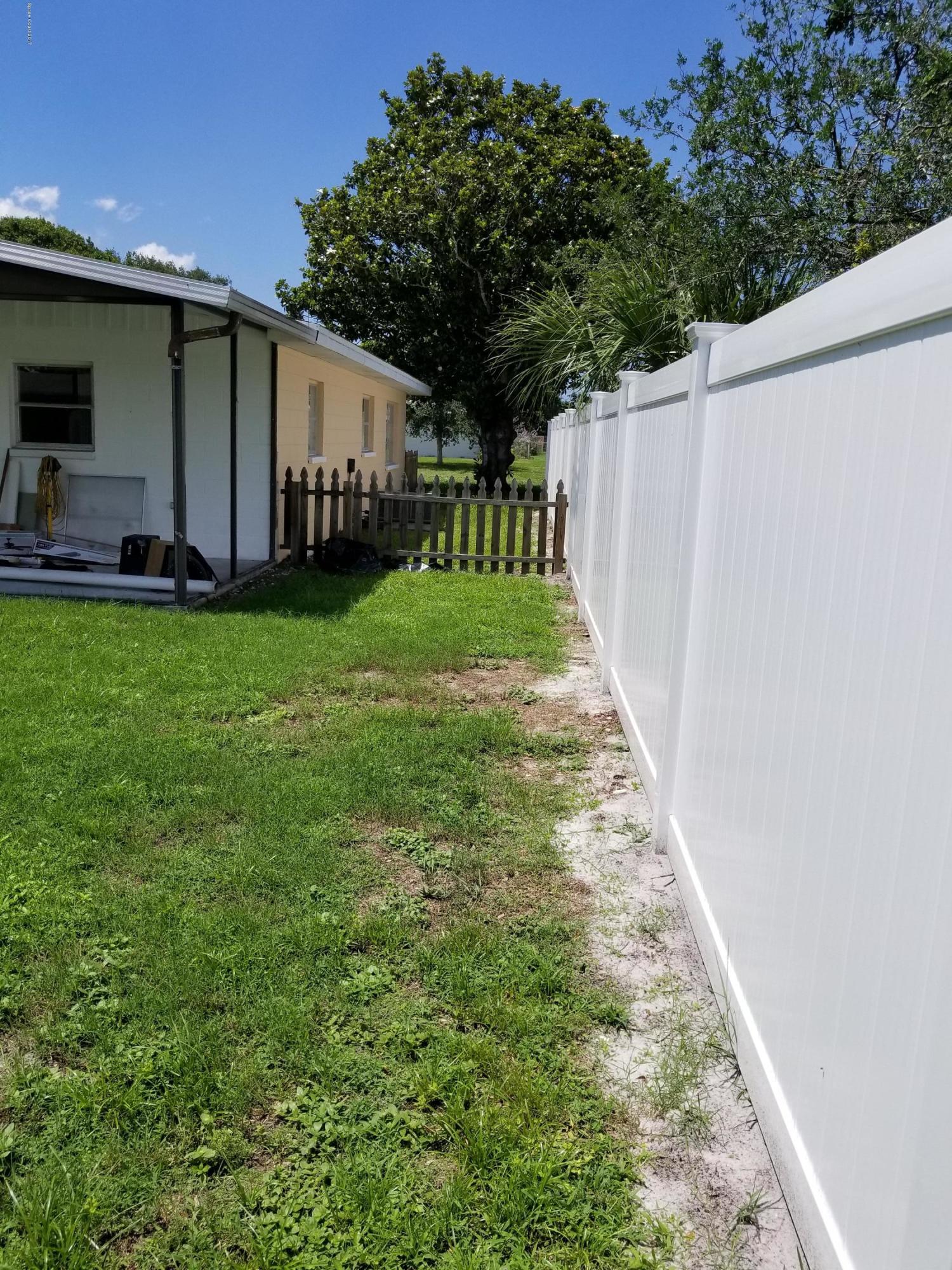 2793 Breeze Ridge Road Melbourne, FL 32935 - Photo 13 of 15 a view of a back yard of the house