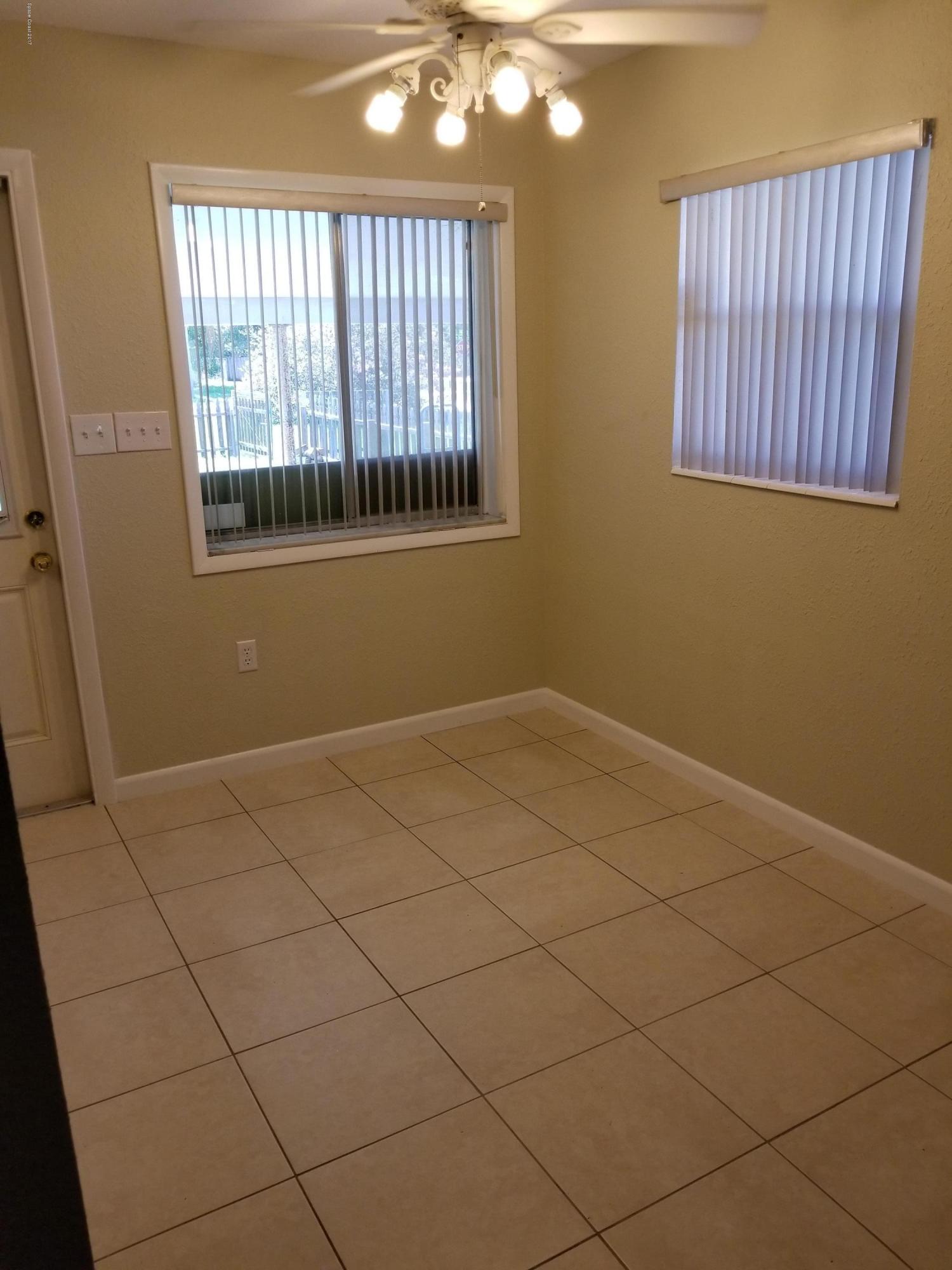 2793 Breeze Ridge Road Melbourne, FL 32935 - Photo 15 of 15 a view of an empty room with a window