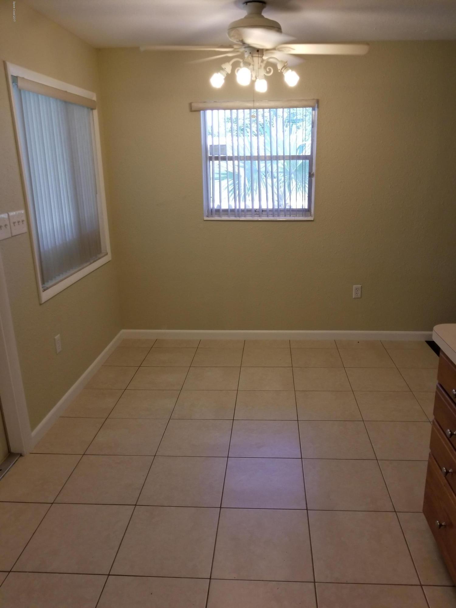 2793 Breeze Ridge Road Melbourne, FL 32935 - Photo 5 of 15 a view of an empty room with a window