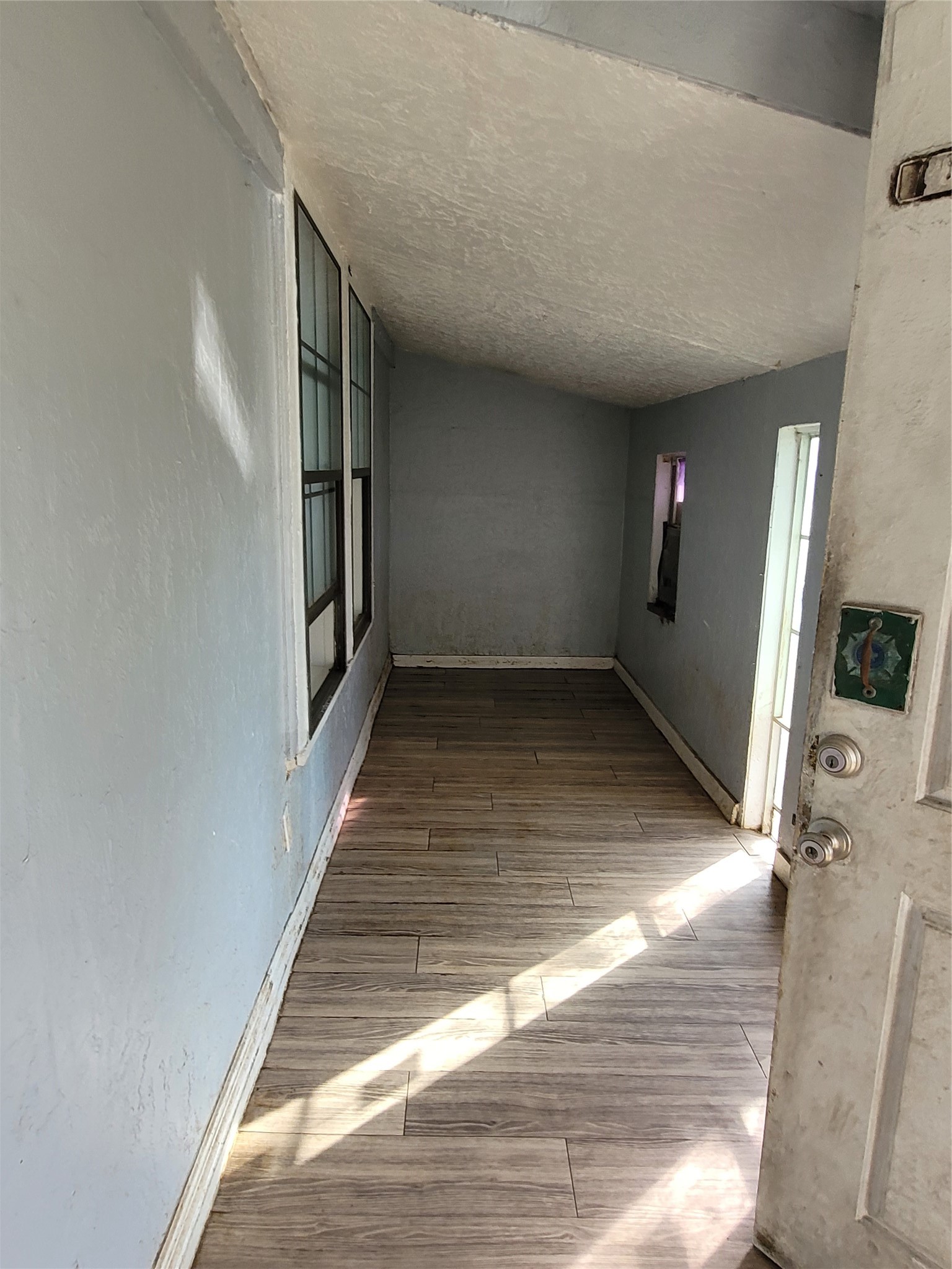 4512 Siegel Street Houston, TX 77009 - Photo 12 of 18 a view of a hallway with wooden floor and staircase