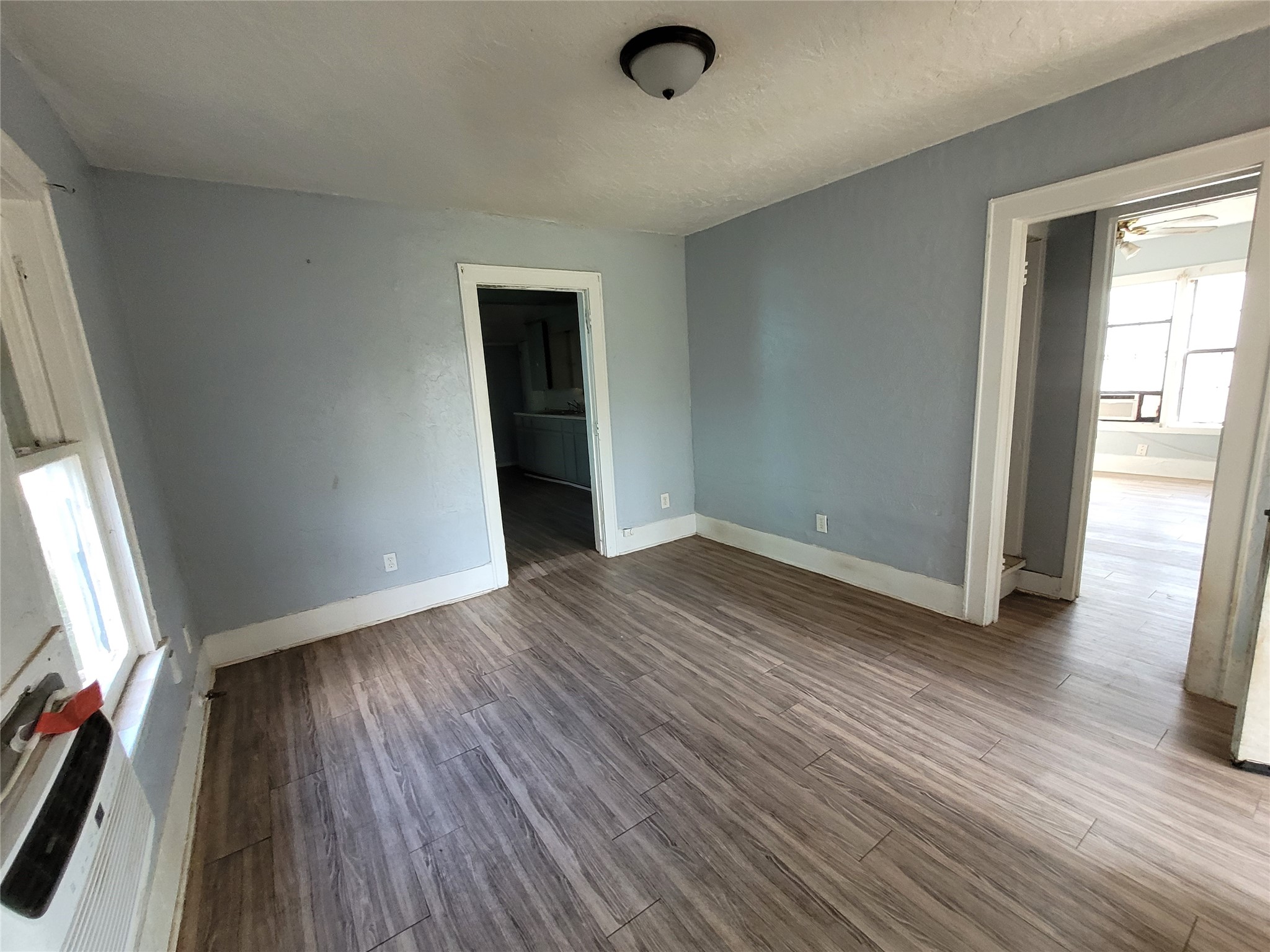 4512 Siegel Street Houston, TX 77009 - Photo 17 of 18 an empty room with wooden floor and windows