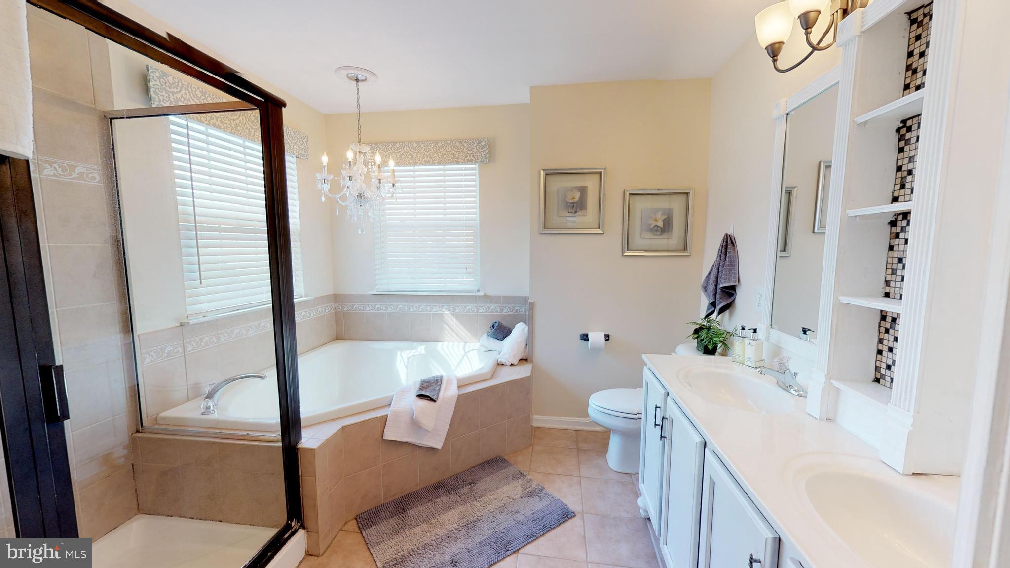 31 Mineral Springs Road Ranson, WV 25438 - Photo 14 of 23 Tiled ensuite master bath with soaking tub