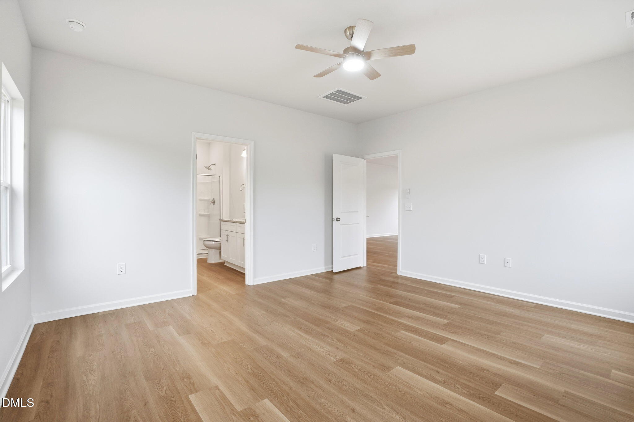 9019 Phoenix Court Spring Hope, NC 27882 - Photo 22 of 34 a view of empty room with wooden floor and ceiling fan