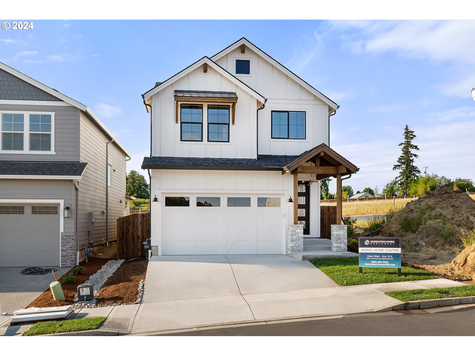 930 Northwest 178th Street Ridgefield, WA 98642 - Photo 1 of 47 a front view of a house with a yard