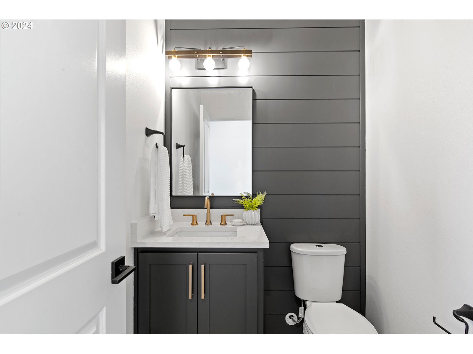 930 Northwest 178th Street Ridgefield, WA 98642 - Photo 11 of 47 a bathroom with a sink toilet and mirror