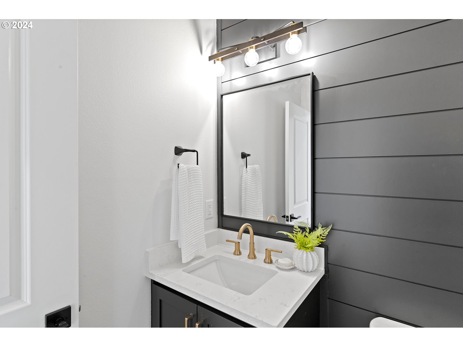 930 Northwest 178th Street Ridgefield, WA 98642 - Photo 12 of 47 a bathroom with a sink and a mirror