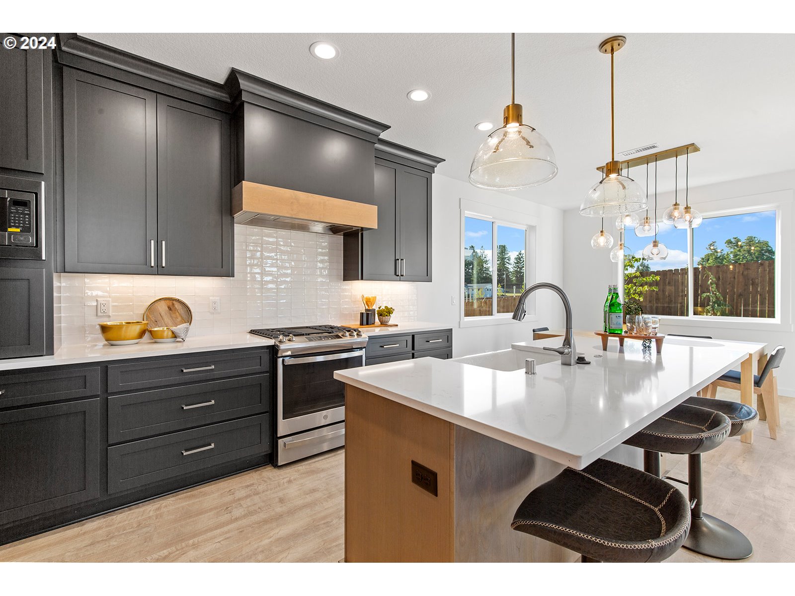 930 Northwest 178th Street Ridgefield, WA 98642 - Photo 34 of 47 a kitchen with a sink appliances and cabinets