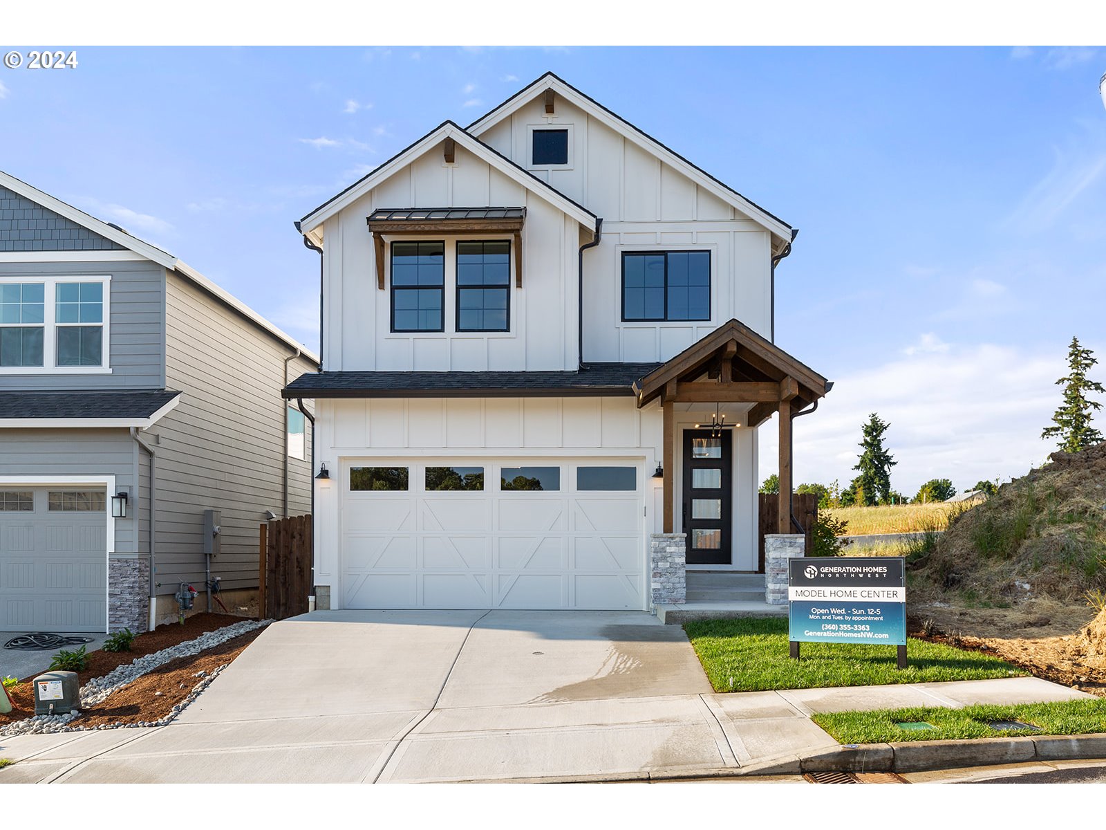 930 Northwest 178th Street Ridgefield, WA 98642 - Photo 4 of 47 a front view of a house with garden