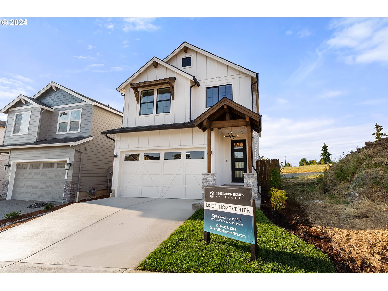 930 Northwest 178th Street Ridgefield, WA 98642 - Photo 5 of 47 a front view of a house with a yard
